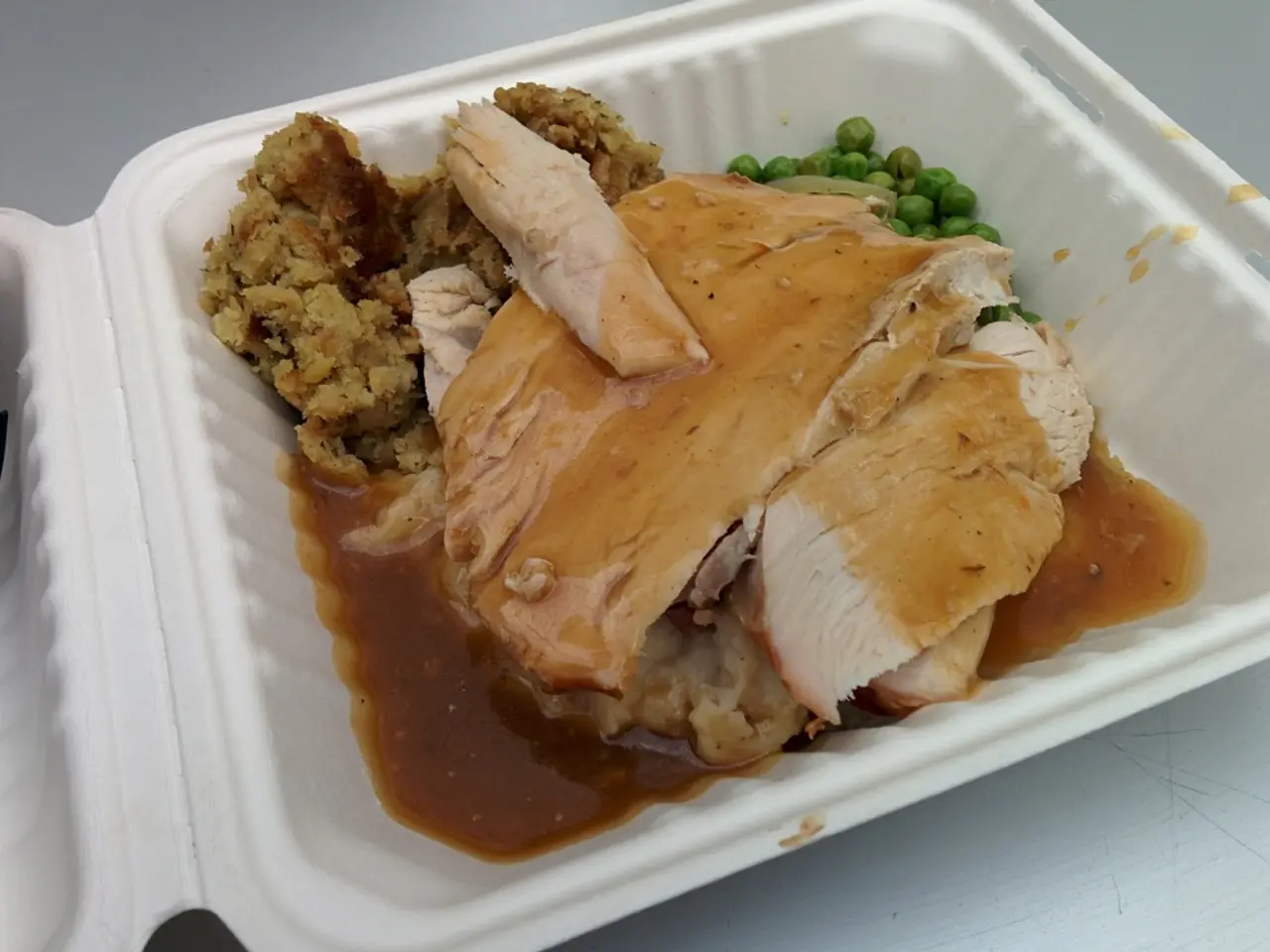 In this picture there is a box in the center of the image, which contains food items.