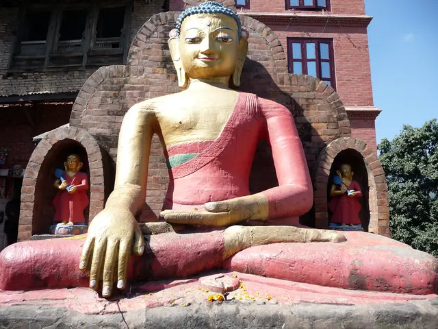 In this picture, we see the idol of the Buddha. Behind that, we see a wall which is made up of the...