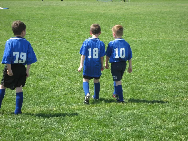 In this picture I can see three kids walking on the grass.